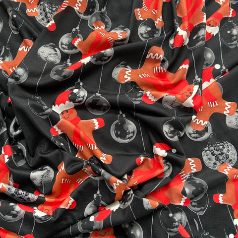 FS692 Christmas Gingerbread Spun Polyester Jersey Knit Stretch Fabric Black | Fabric | bauble, Baubles, Black, Candy Cane, Candy Stick, Christmas, christmas tree, Fabric, Gingerbread, Gold, Navy, Santa, Spun Polyester, Spun Polyester Elastane, Star, xmas | Fabric Styles