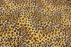 Golden Leopard Fleece Fabric Pink Black Spots with Stretch