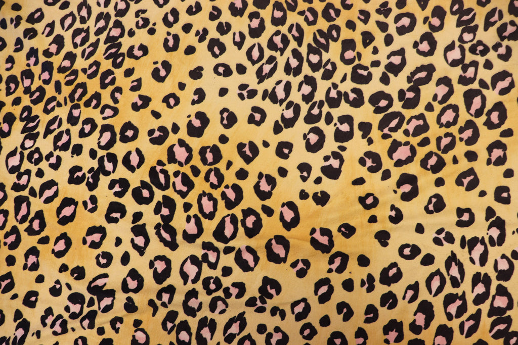 Golden Leopard Fleece Fabric Pink Black Spots with Stretch