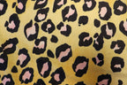 Golden Leopard Fleece Fabric Pink Black Spots with Stretch