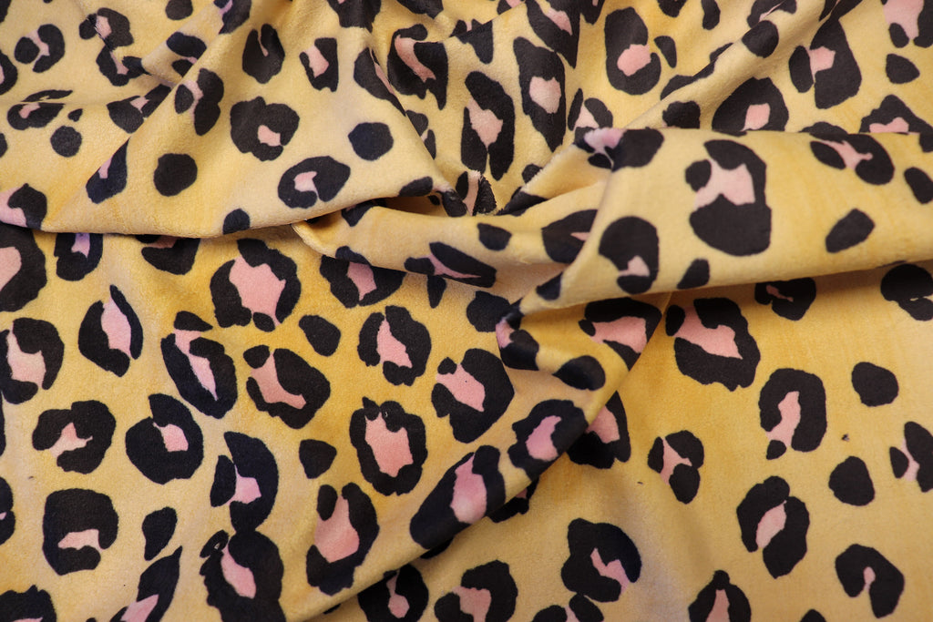 Golden Leopard Fleece Fabric Pink Black Spots with Stretch