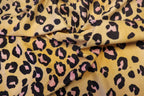 Golden Leopard Fleece Fabric Pink Black Spots with Stretch
