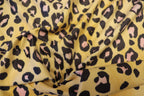Golden Leopard Fleece Fabric Pink Black Spots with Stretch