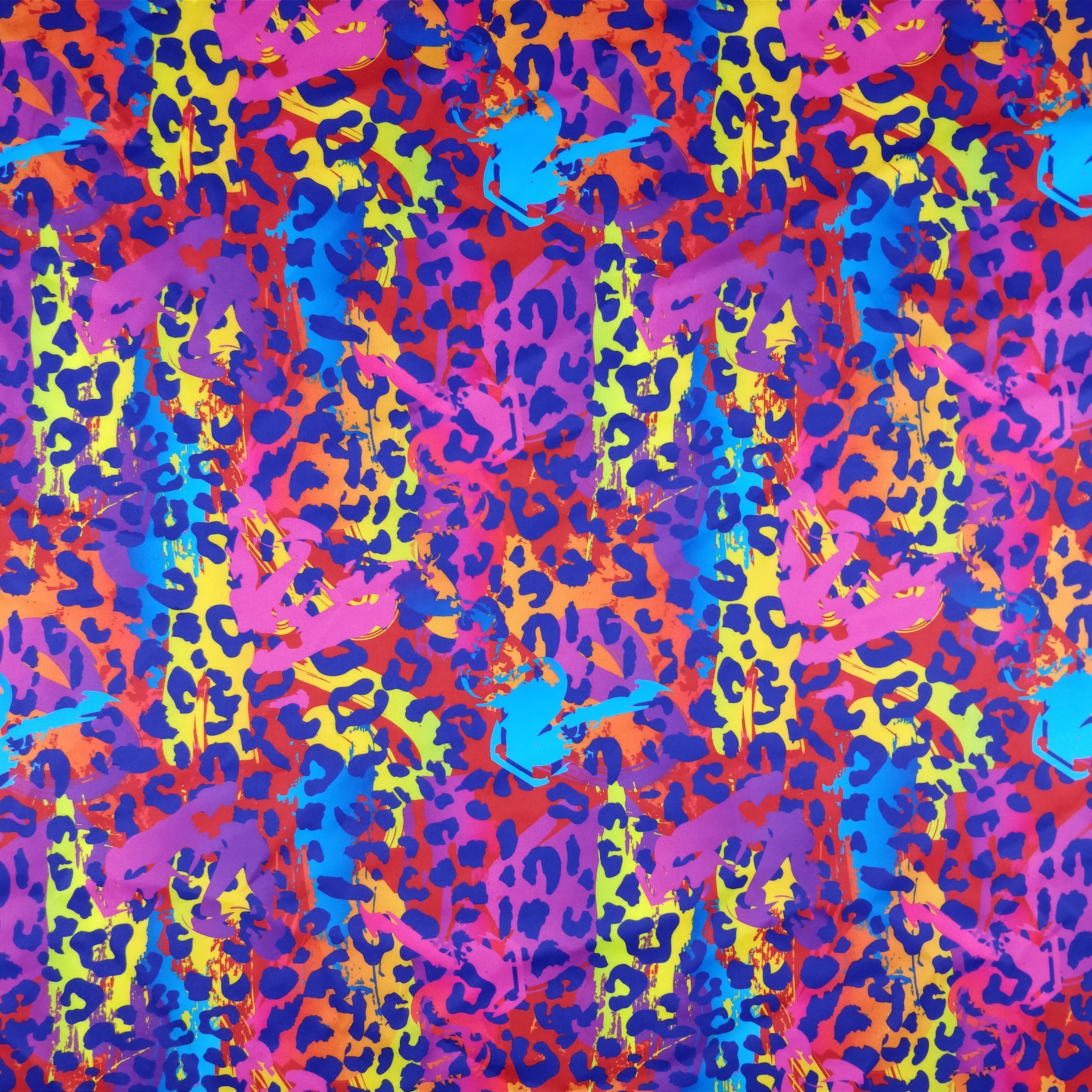 Colorful leopard print pattern with pink, blue, purple, and yellow.
