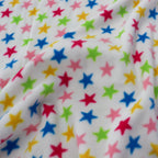 FS743_1 Multicolour Stars Fleece Fabric White