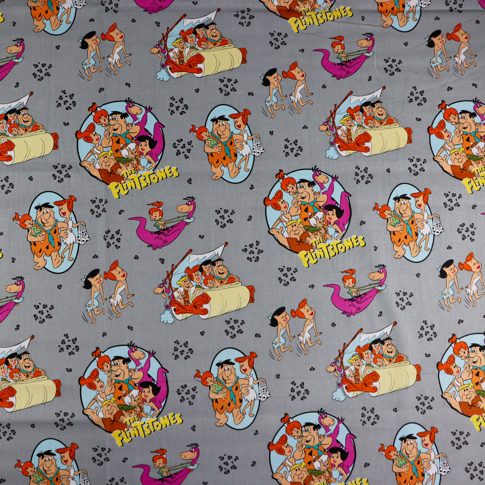 FS802 The Flintstones Cotton Fabric Grey | Fabric | Blue, Brand, Branded, Children, Cotton, drape, Fabric, fashion fabric, Flinstone, Flinstones, Grey, Grey Base, hero, Kids, logo, sewing | Fabric Styles
