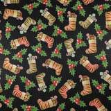 FS078 Christmas Print, Stockings Holly | Fabric | Black, candy, Christmas, fabric, Holly, jersey, polyester, presents, Sale, spun polyester, Spun Polyester Elastane, Stocking, stockings, Sweets, xmas | Fabric Styles