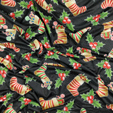 FS078 Christmas Print, Stockings Holly | Fabric | Black, candy, Christmas, fabric, Holly, jersey, polyester, presents, Sale, spun polyester, Spun Polyester Elastane, Stocking, stockings, Sweets, xmas | Fabric Styles