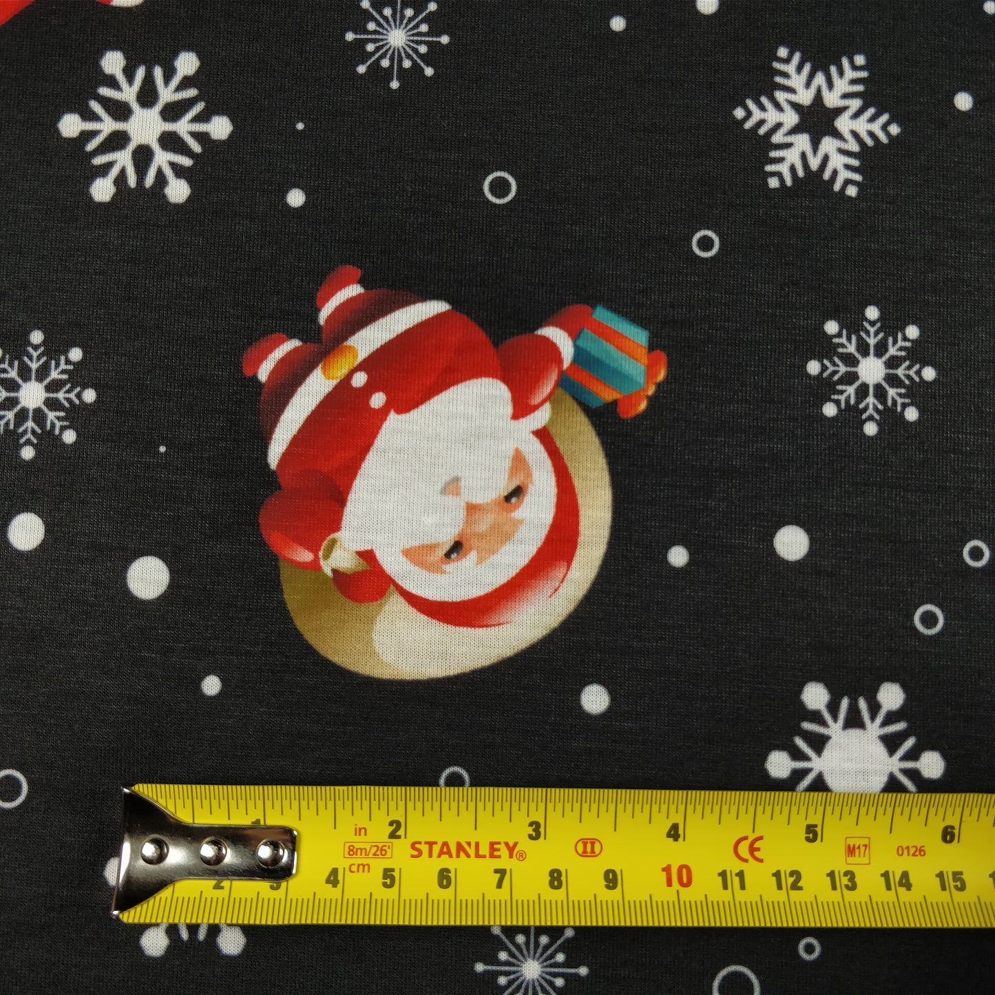 FS074 Christmas Print, Santa, Snowflakes, Sledge, Presents Spun Polyester Knit Stretch Fabric Black | Fabric | Christmas, fabric, jersey, polyester, Present, presents, rudolf, santa, Santa Clause, sledge, Snow, Snowflake, snowflakes, spun polyester, Spun Polyester Elastane, xmas | Fabric Styles
