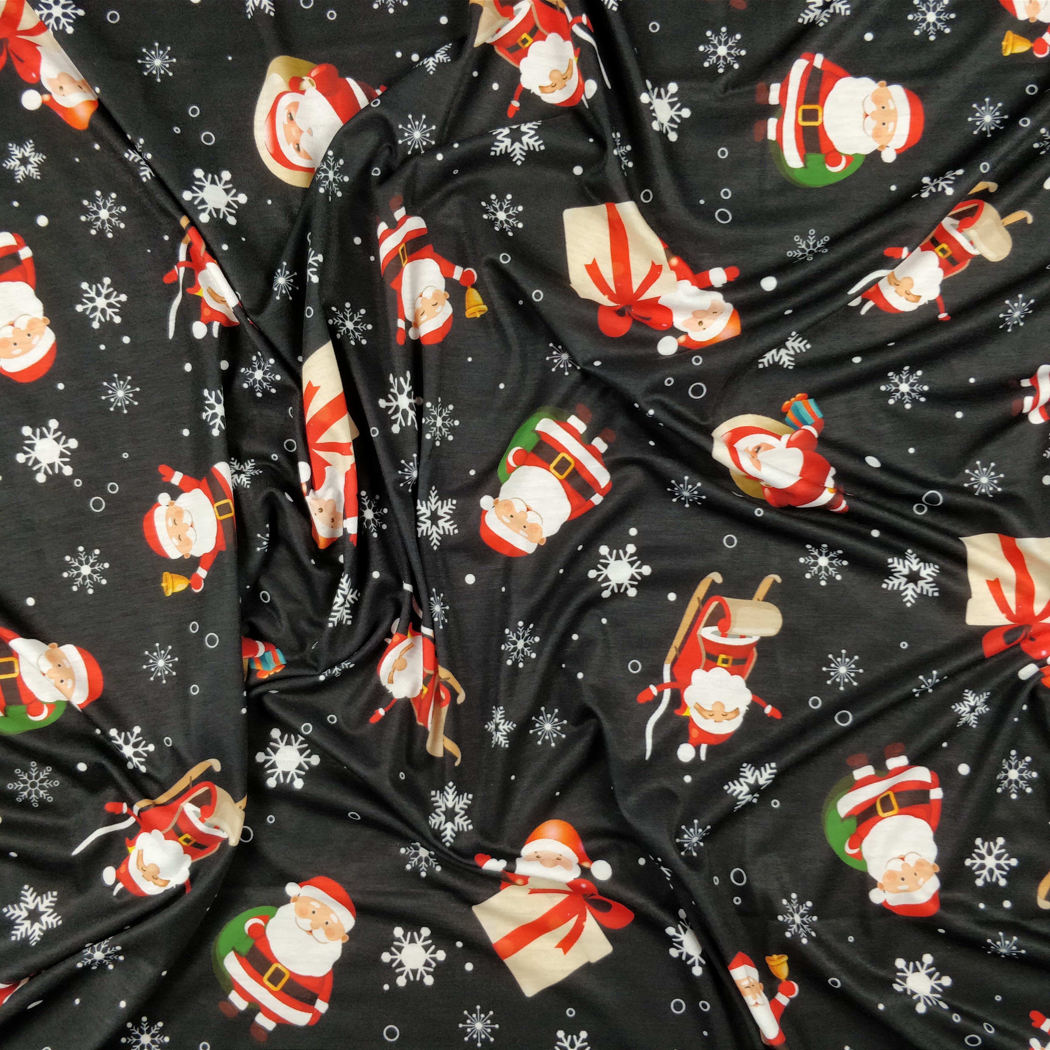 FS074 Christmas Print, Santa, Snowflakes, Sledge, Presents Spun Polyester Knit Stretch Fabric Black | Fabric | Christmas, fabric, jersey, polyester, Present, presents, rudolf, santa, Santa Clause, sledge, Snow, Snowflake, snowflakes, spun polyester, Spun Polyester Elastane, xmas | Fabric Styles