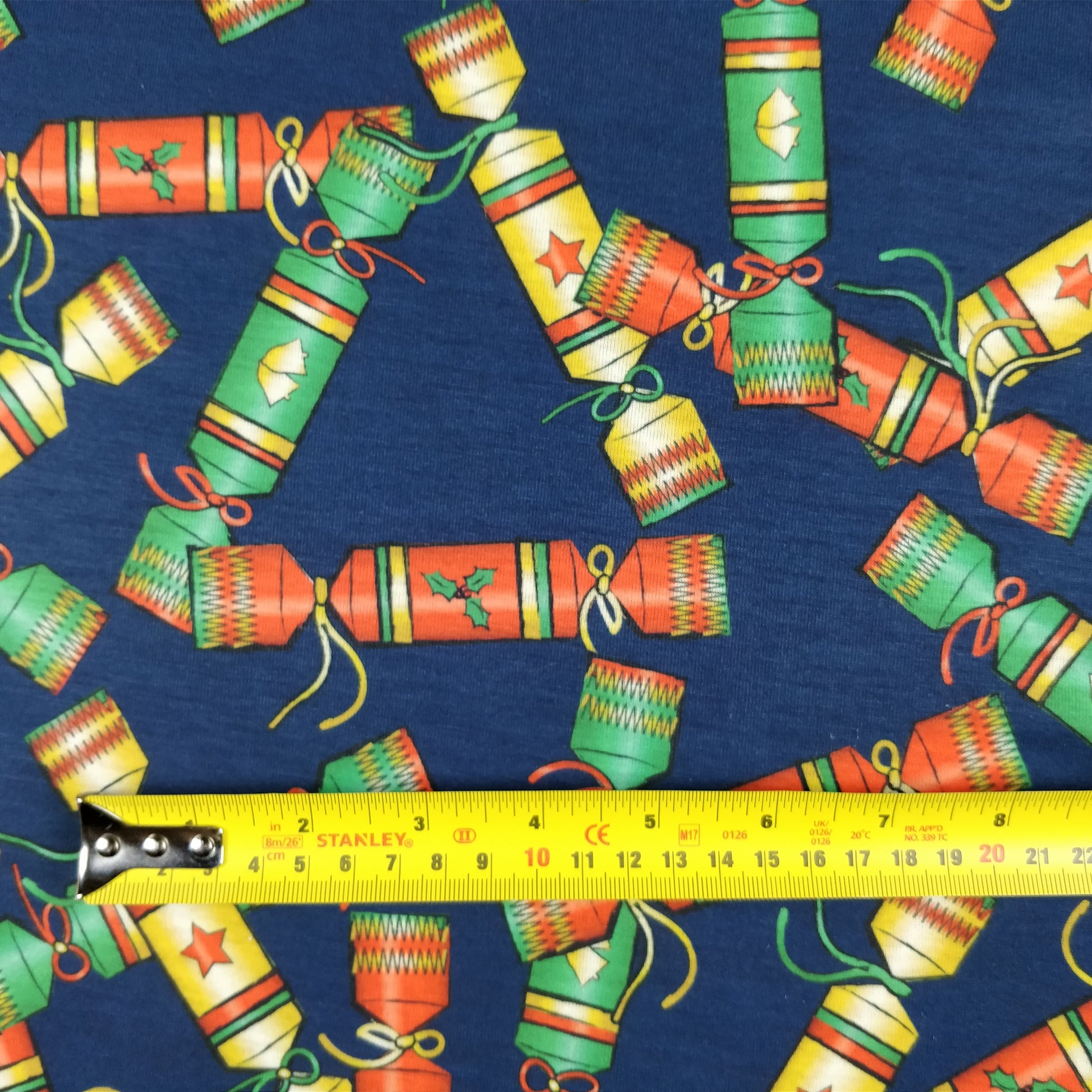 FS157 Christmas Crackers Spun Polyester Knit Stretch Fabric Navy | Fabric | Christmas, Cracker, Crackers, fabric, Green, jersey, Navy, polyester, spun polyester, xmas | Fabric Styles